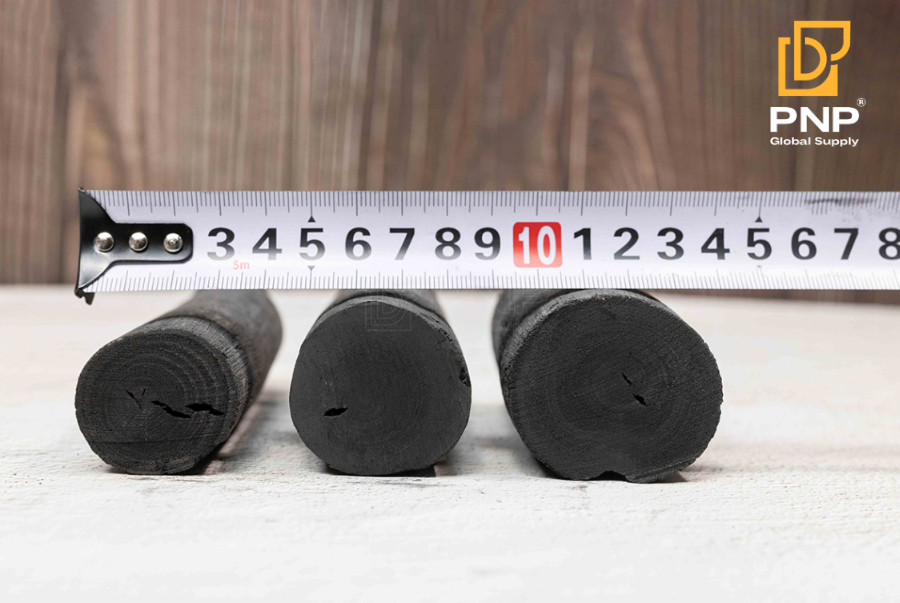 White charcoal briquettes stacked neatly for storage