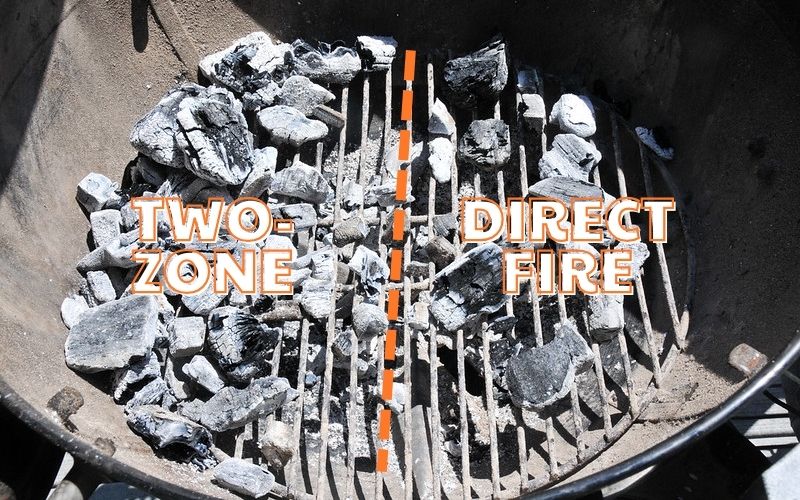 Charcoal are arranged in a two-zone direct fire method with one side having a higher concentration of coals than the other