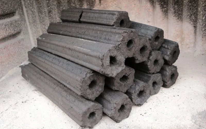 A stack of hexagonal high-quality sawdust briquette charcoal