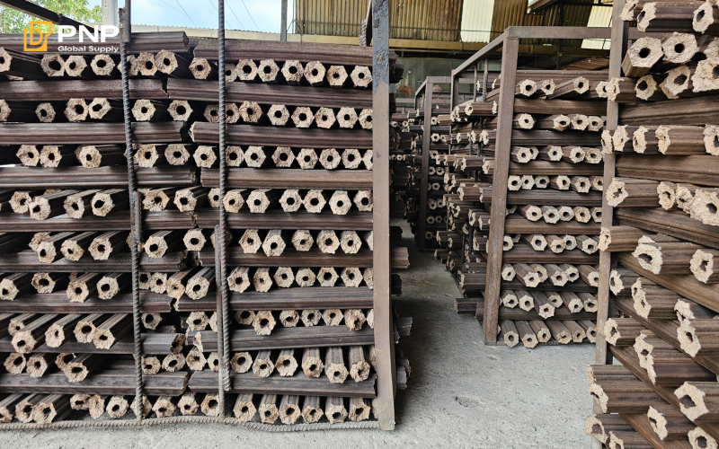 Sawdust is mixed with binding agents like starch or clay to facilitate holding particles