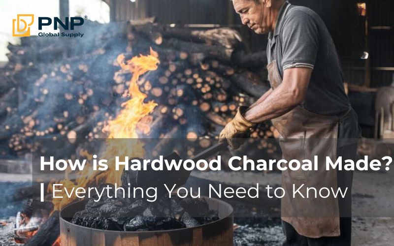 A worker stacking wood in a kiln to demonstrate the process of how charcoal is made.