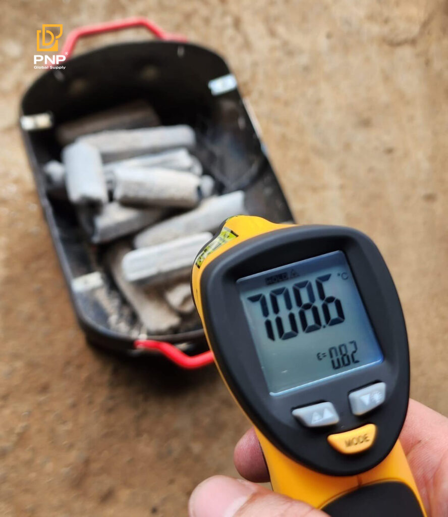 Check temperature of sawdust charcoal