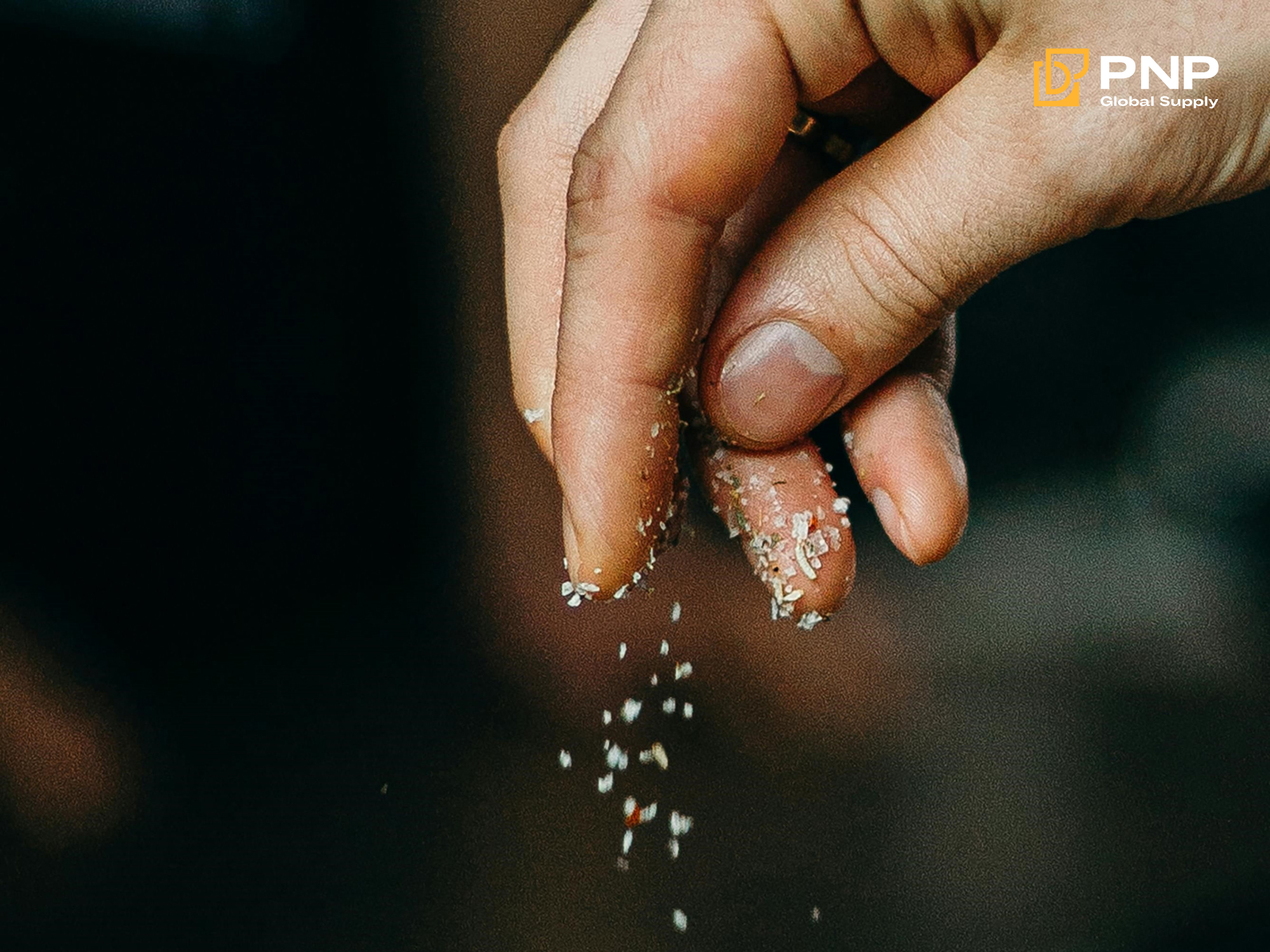 Putting salt on charcoal