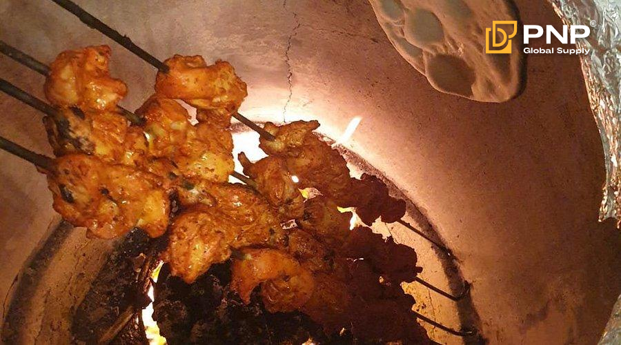 How to Make Grilled Tandoori Chicken at Home 2 Cooking in a tandoor gives the chicken a deeper, more flavorful taste