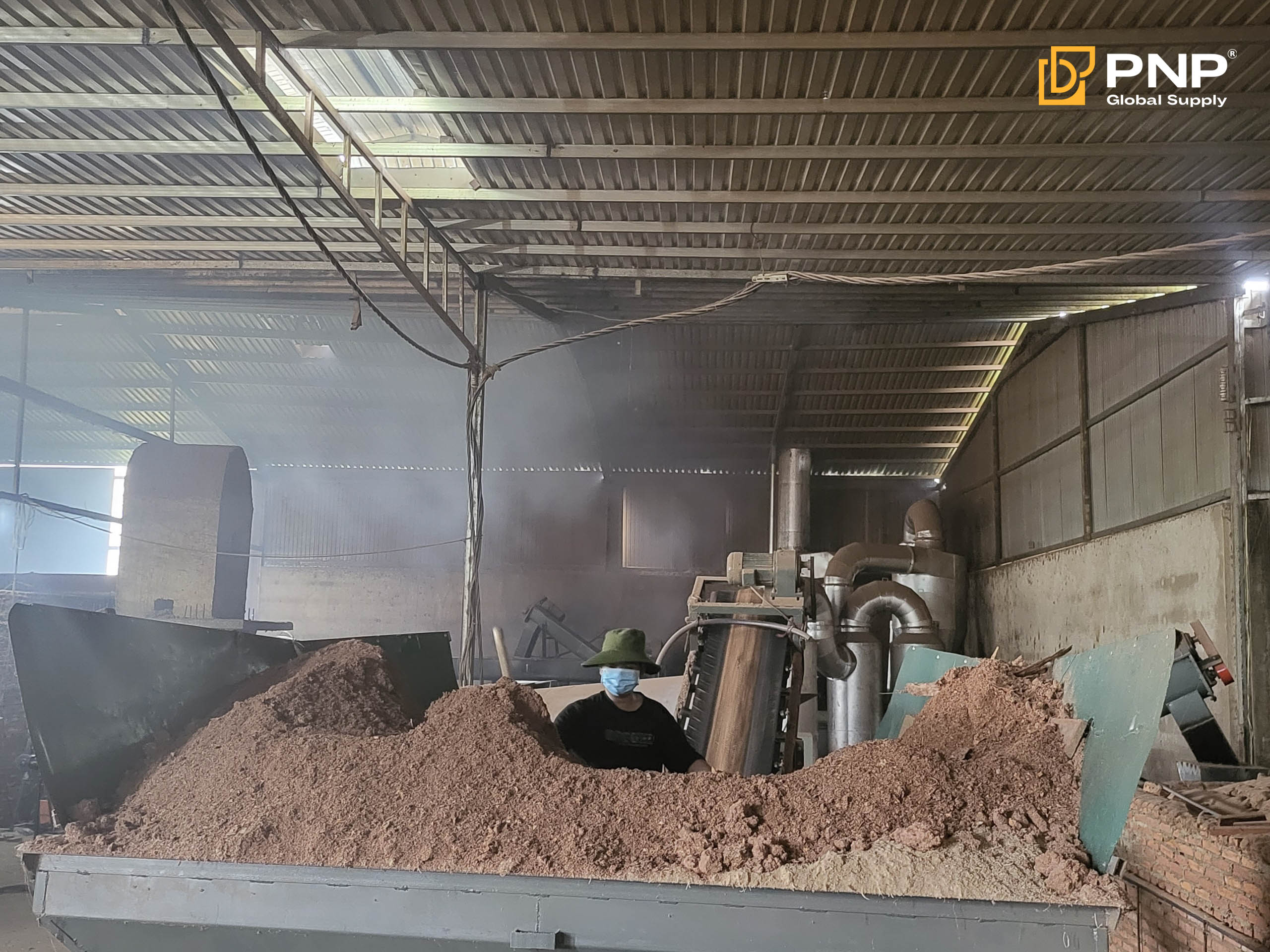 Sawdust is dried and processed to produce consistent charcoal briquettes
