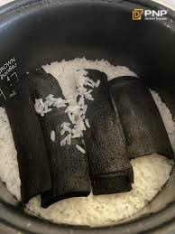 Charcoal is placed in the rice pot to remove the burnt smell.