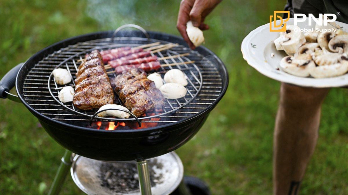 A charcoal BBQ grill creates smoky flavor for classic backyard cooking
