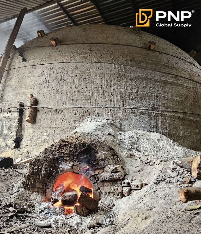 A traditional charcoal kiln in Vietnam uses wood stacking, soil covering, controlled airflow to produce charcoal