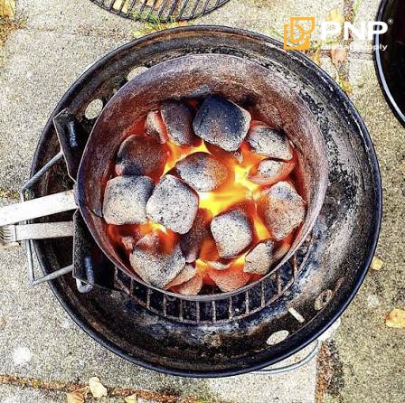 How to Light Charcoal with a Charcoal Chimney 2 light charcoal with a charcoal chimney for BBQ