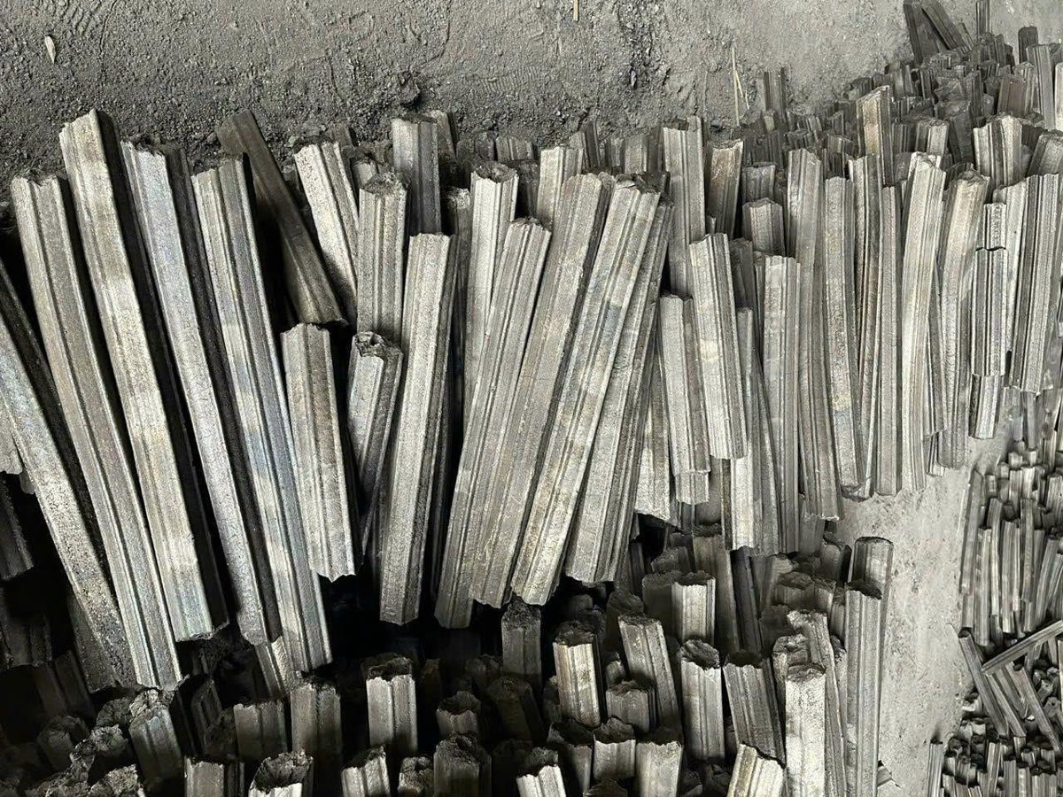 Carbonized sawdust briquettes differ from compressed raw-wood fuel.